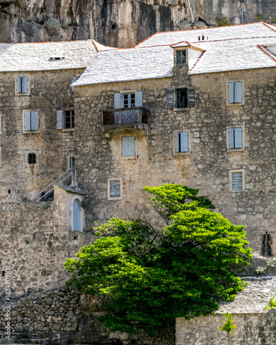 Croatia's Breč Island in Dalmatia. The beautiful and historic Blaca Monastery is surrounded by mountains above the Adriatic Sea.