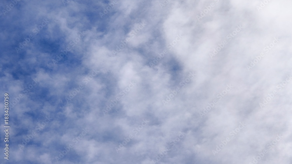 Fototapeta premium Blue Sky with Scattered Altocumulus and Cirrocumulus Clouds