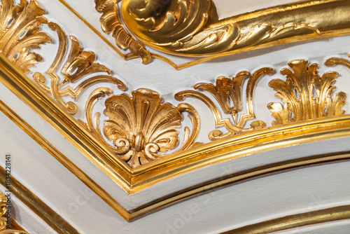 Luxurious ceiling corner ornament featuring gilded swirling acanthus scrolls