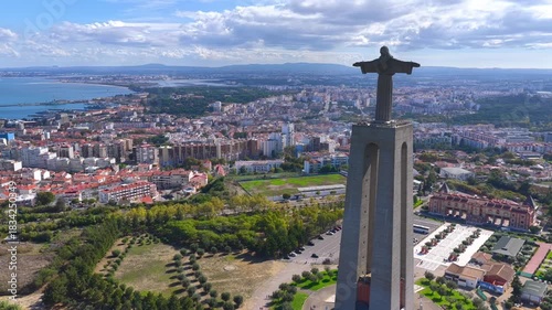 Wide Aerial Drone View of Cristo Rei Sanctuary Overlooking Lisbon Cityscape and the Tagus River in Portugal – Scenic Landscape, Urban Panorama and Iconic Monument from Above