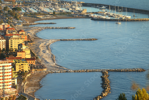 Resort town by sea. Tourism, marina, yachts and recreation, Chiavari, Italy. View from mountain on sunny day.