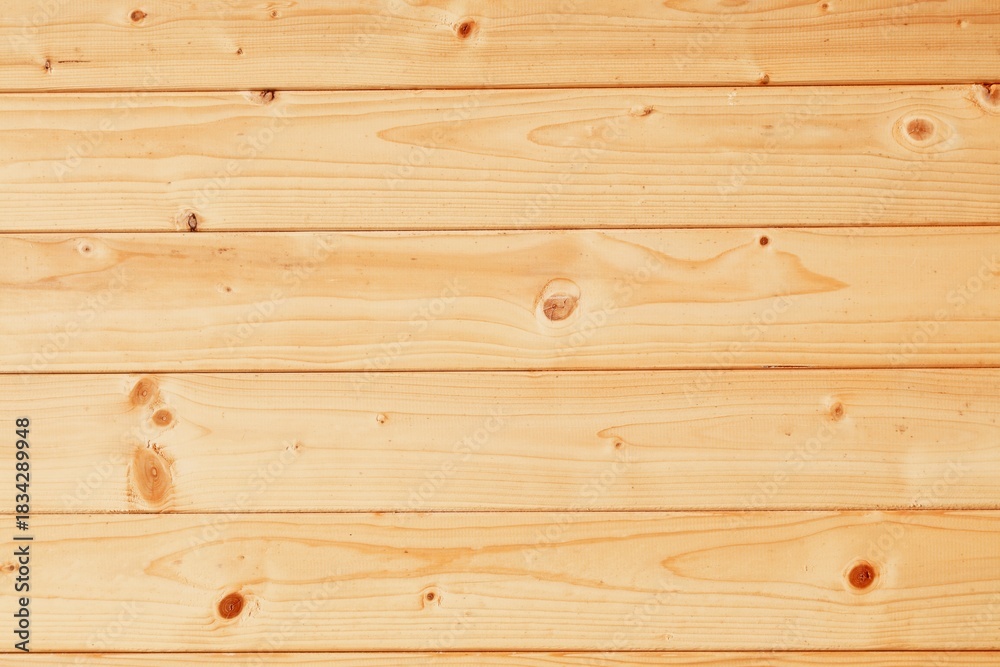 Fototapeta premium Pine wood wall light brown background. Pine boards building paneling. Natural wood background.