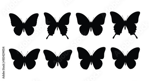 Simple black silhouettes of butterflies arranged in rows against a white background