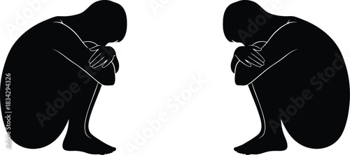 Two solitary figures silhouetted in contemplation