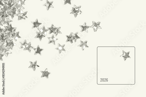 Silver star shaped sequins scattered on a light minimal background with one isolated star inside a clean frame creating a festive abstract composition for celebration and decoration themes. Frame