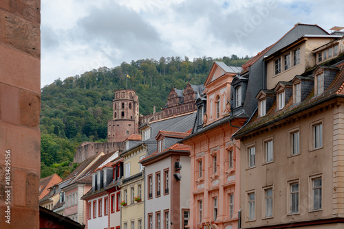 Kornmarkt Square and Heidelberg Castle.Old town Kornmarkt square buildings with Heidelberg Castle in the background.
