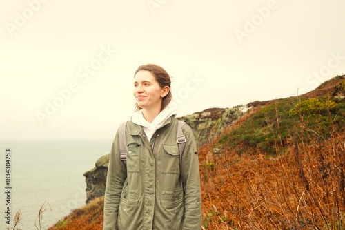 Portrait of a young girl hiking in the beautiful places of Ireland