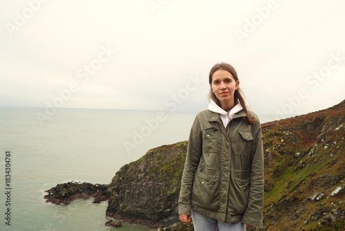 Portrait of a young girl hiking in the beautiful places of Ireland