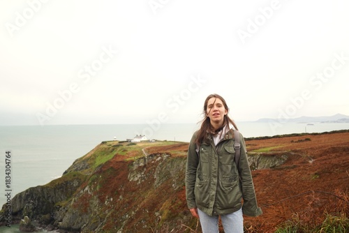 Portrait of a young girl hiking in the beautiful places of Ireland