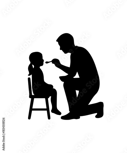 Father feeding baby in high chair silhouette