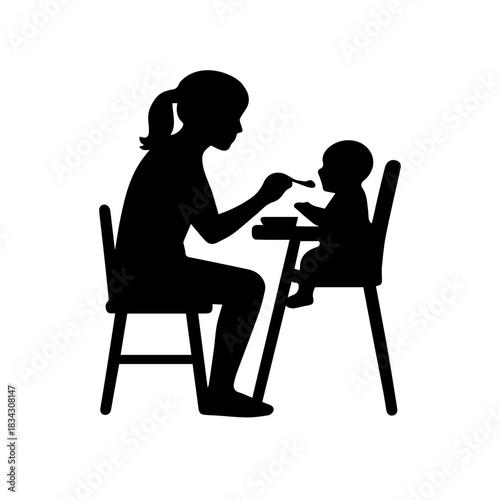 Mother feeding baby in high chair silhouette