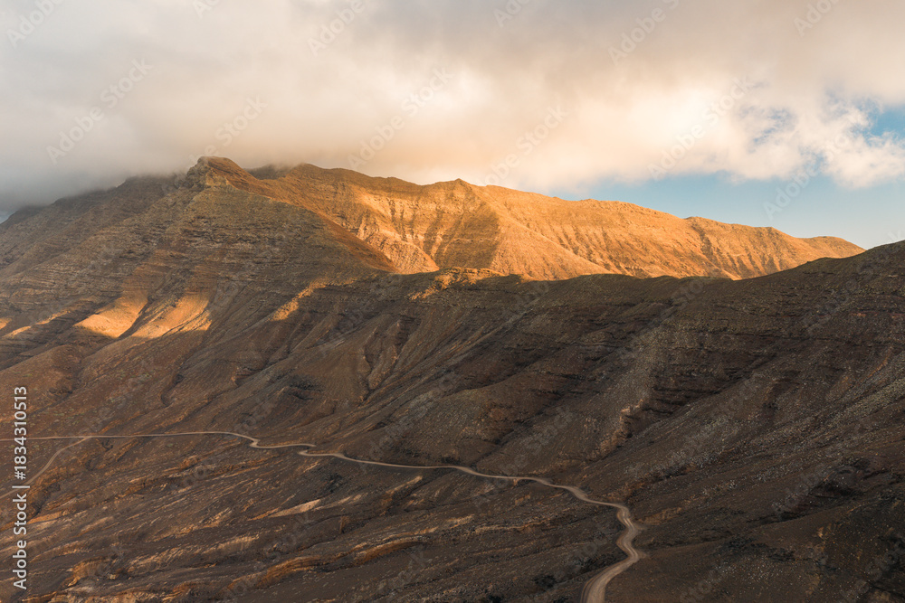 Fototapeta premium The Mirador de Cofete on Fuerteventura is a viewpoint that offers spectacular views of the wild west coast, the long Cofete beach, and the Jandía mountains