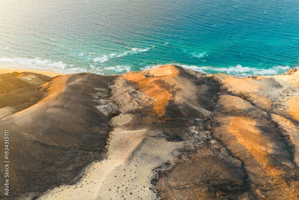 Naklejka premium The Playa Larga is located in the southern part of the Jandía peninsula in Fuerteventura and is a wild and sprawling stretch of coastline, roughly 1.5 kilometers long