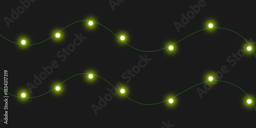 Two wavy strings of glowing chartreuse fairy lights on a dark background, creating a festive and magical atmosphere.