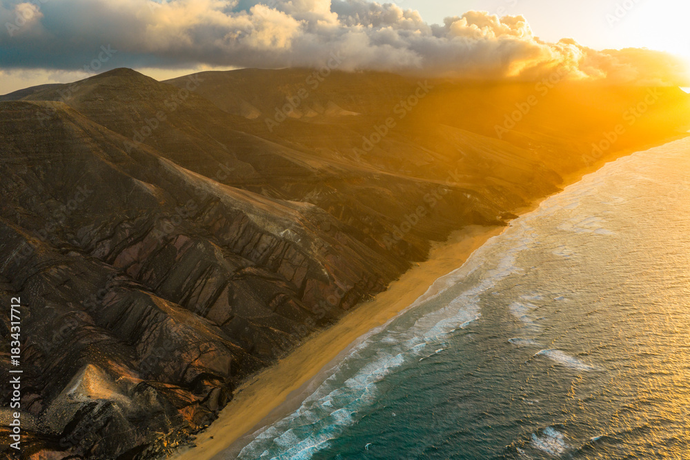 Naklejka premium The Playa Larga is located in the southern part of the Jandía peninsula in Fuerteventura and is a wild and sprawling stretch of coastline, roughly 1.5 kilometers long