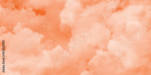 Pink Clouds Against a Warm Orange Sky at Sunrise. fantasy blurred cloudy sky with gradient color and grunge paper texture . White clouds in a sky. Light brown aesthetic. Monochrome cloudscape concept 