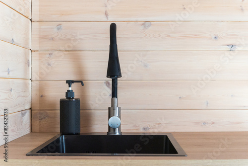 kitchen faucet on a stylish metal sink