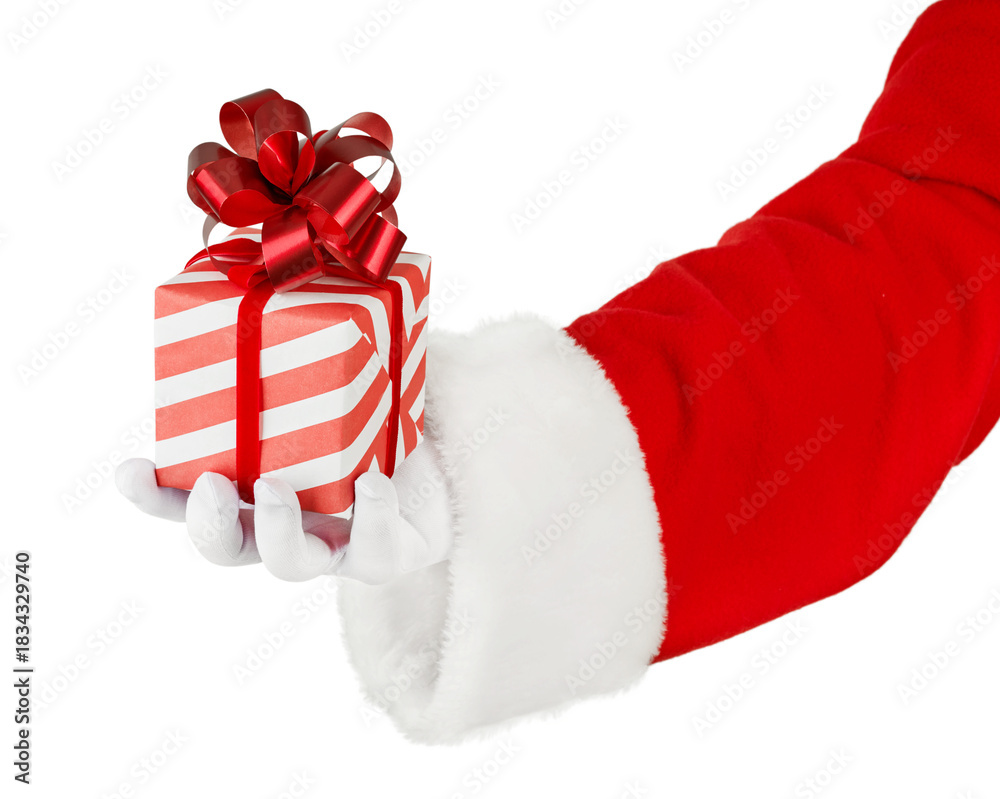 Fototapeta premium Christmas Santa Claus hand holding red gift box with red bow isolated on white background with clipping path. Design element.