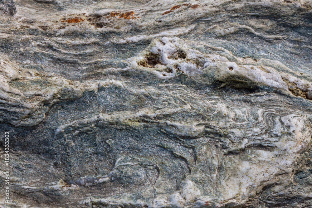Ταπετσαρία A close-up of schist reveals layered mineral textures shaped by heat and pressure—nature’s geological memory