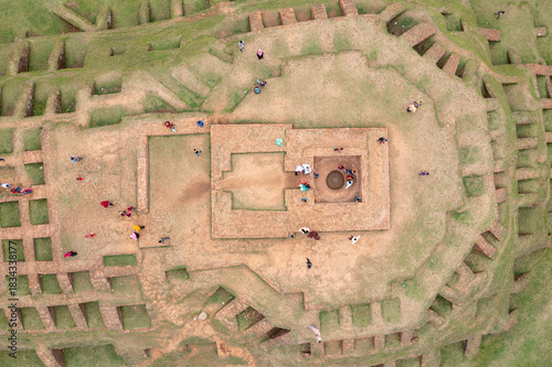 Aerial view of a well-preserved ancient structure displaying intricate brickwork and verdant surroundings, creating a captivating contrast of history and nature, Bogura, Rajshahi Division, Bangladesh.
