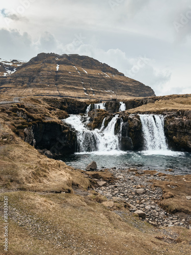 Kirkjufellsfoss waterfall and Kirkjufell mountain