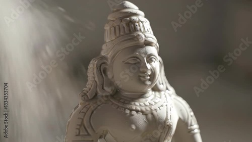 Hindu goddess statue in bright hazy light. Religious sculpture, goddess figure. Spiritual, Hinduism, religion, statue, sculpture, bright light.