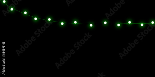 A string of glowing green fairy lights hangs in a gentle arc against a solid black background.