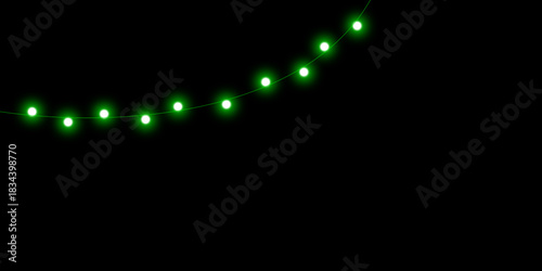 An arc of glowing green fairy lights hanging against a solid black background.
