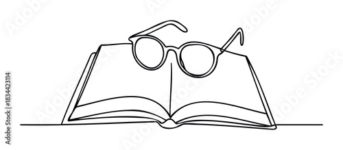 An open book with reading glasses on top represents education and study. Useful for concepts of knowledge and literature.