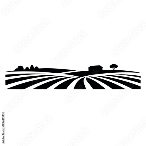 Silhouette of a farm landscape with fields and buildings