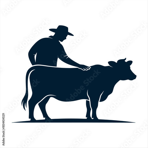 Farmer silhouette tending to a cow