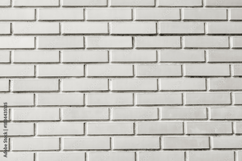 Naklejka premium Clean white brick wall pattern for architecture backdrop and design Demonstration Color of the Year 2026