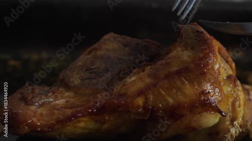 close-up of slicing a freshly prepared hot appetizing piece of meat, slicing a tasty hot piece of meat into parts
