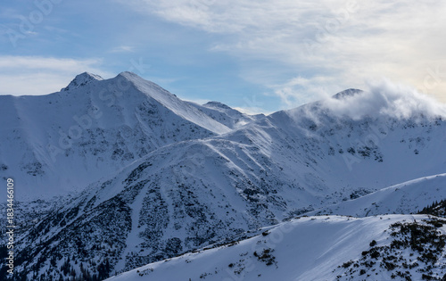 Fototapeta Naklejka Na Ścianę i Meble -  Snow-capped peaks of the Western Tatras in winter.