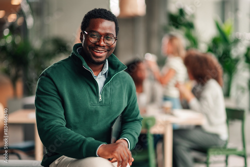 African american businessman smiling at modern office