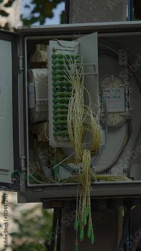 streetside fiber connection infrastructure, telecommunications junction box with organized cabling