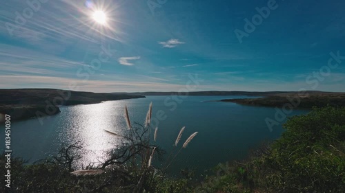 Bright Sun Flare Over Drakes Estero Lagoon with Foreground Grasses, Point Reyes