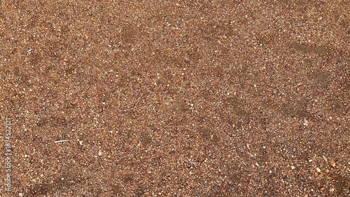 Little mini pebbles texture. Orange brown natural background.
