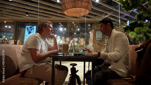 Wallpaper Mural Timelapse capturing a friend’s conversation in a cozy coffee shop Torontodigital.ca