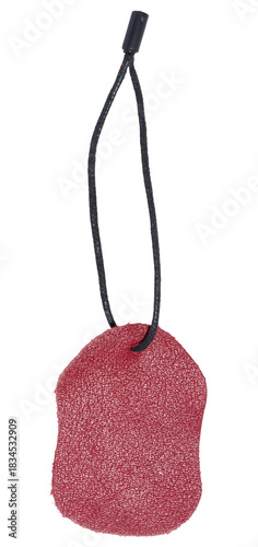 Red leather tag or label on a black cord, isolated background. Blank price tag
