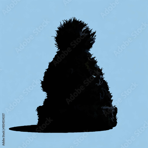 Black Winter Hat Silhouette on Blue Background

