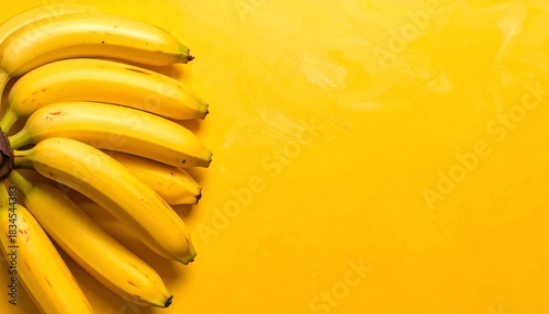 Vibrant Yellow Banana Bunch with Artistic Yellow Background for Creative Design