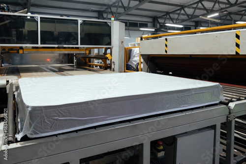 Process of vacuum packing of mattress. Mattress packing machine
