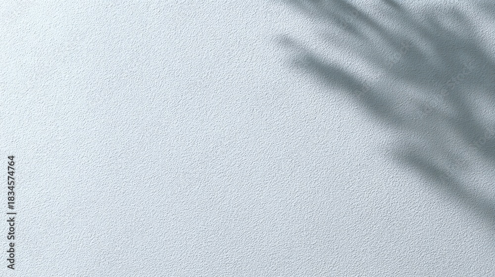 Fototapeta premium Soft Textured Wall with Subtle Shadow Play from Natural Light and Delicate Foliage for Minimalist and Contemporary Design Aesthetics