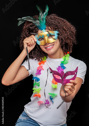 Woman celebrating with carnival mask