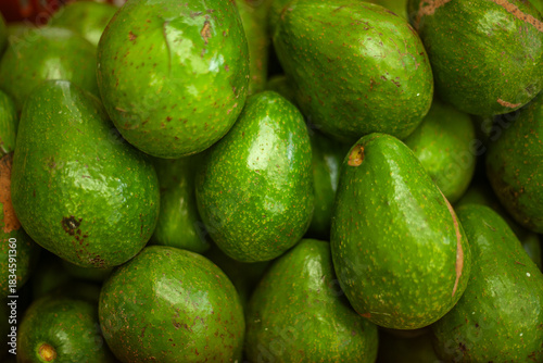 Green avocados in top-down view