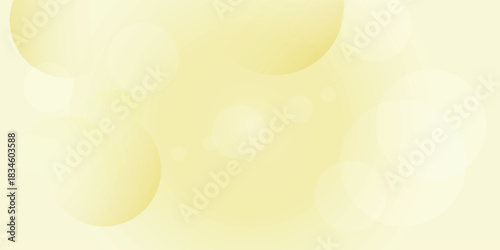Soft yellow abstract background with blurred circular bokeh lights creating a gentle and ethereal visual effect.