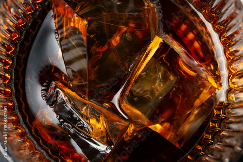 Macro Shot of Whiskey with Ice – Amber Scotch on the Rocks Close-Up