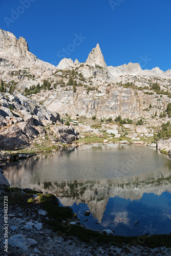 Sierra Rock Spire Reflected In Small Lake