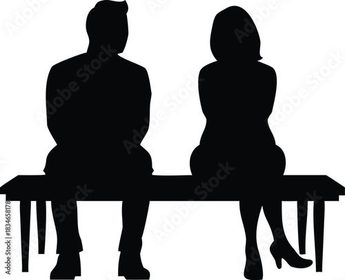 Man and woman silhouetted sitting on a bench illustrate disconnection, separation, or perhaps reflection in solitude.
